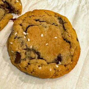 Tahini chocolate chip cookies with sesame seeds on top from the back of the 365 brand chocolate chips bag.