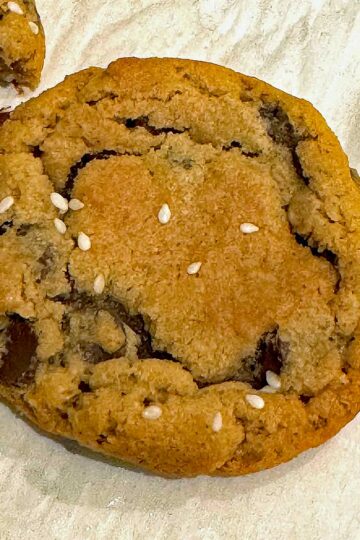 Tahini chocolate chip cookies with sesame seeds on top from the back of the 365 brand chocolate chips bag.