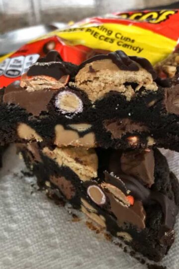 Thick dark chocolate cookies filled with Reese's baking cups, miniature Reese's and Reese's Pieces.