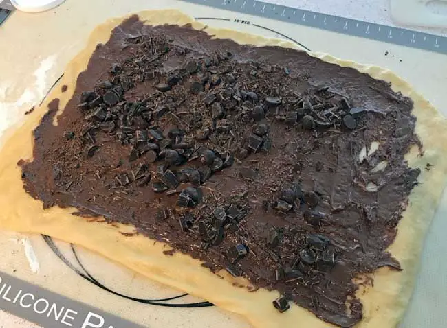 hazelnut chocolate babka with Nutella and chocolate on top.
