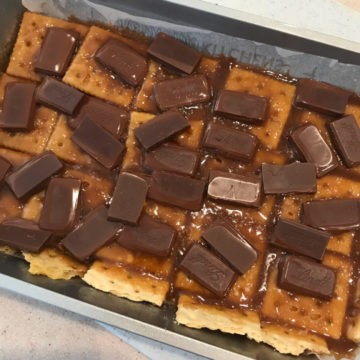 Saltine Cracker Candy as a half batch. This picture shows the chocolate melting over the toffee mixture.