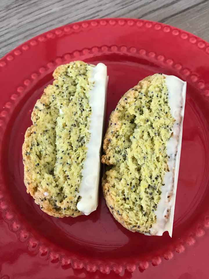 Sourdough Lemon Poppy Seed Biscotti on a red plate.