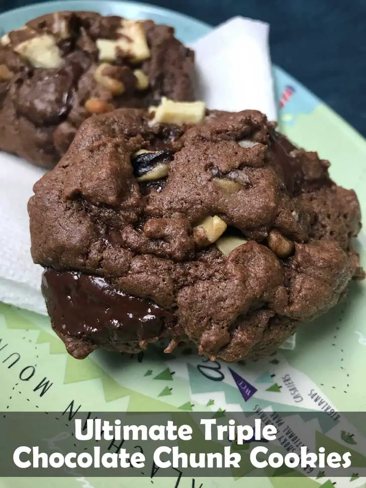 Ultimate Triple Chocolate Chunk Cookies made with I Can't Believe it's Not Butter sitting on a plate.