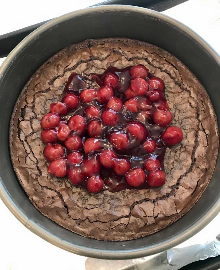 Cherry Topped Brownie Cheesecake with Lucky Leaf brand cherry pie filling.