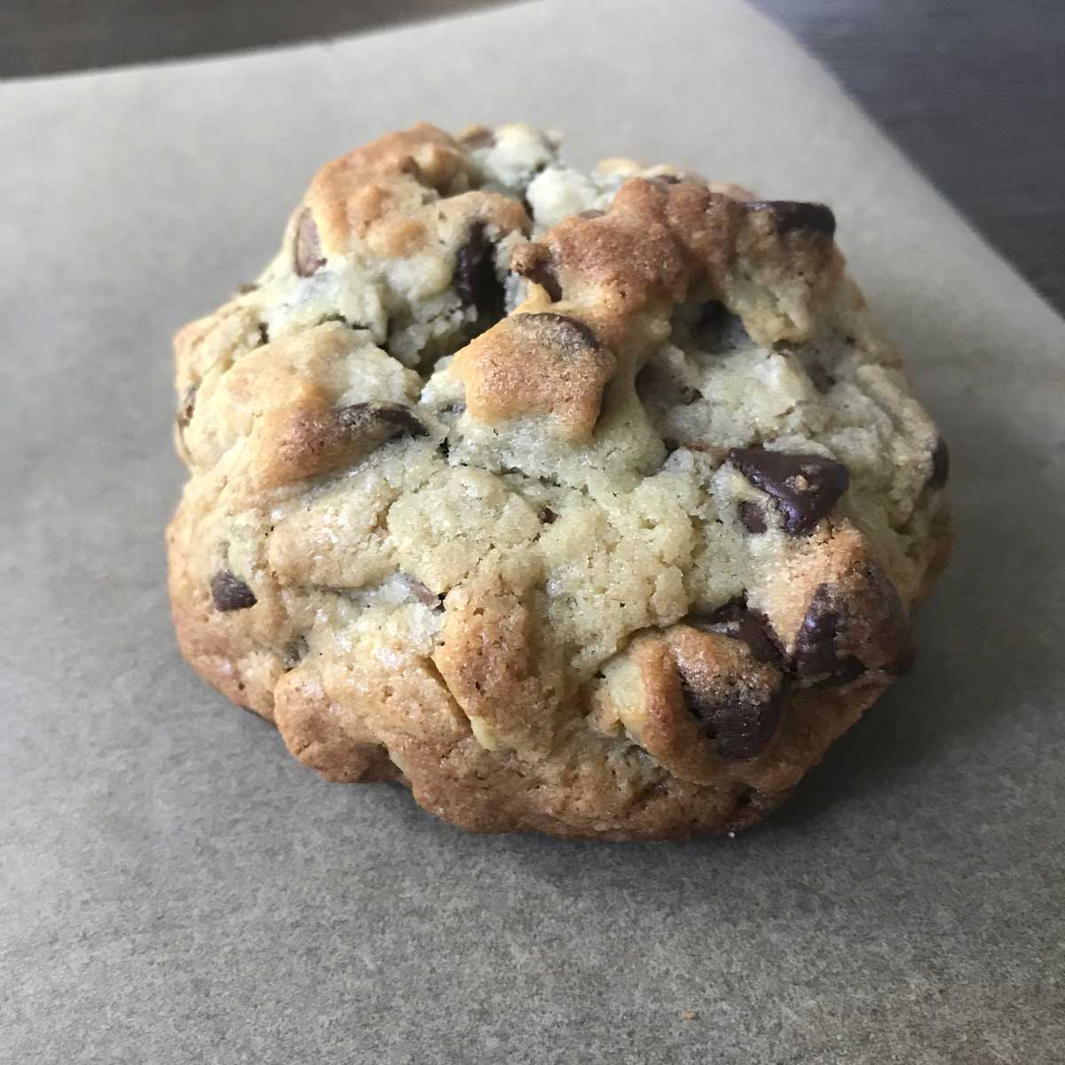 Levain bakery style chocolate chip cookie with walnuts.