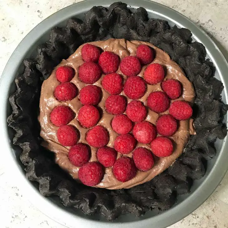 Chocolate Pastry Crust filled with whipped cream, cream cheese, melted chocolate and raspberries.