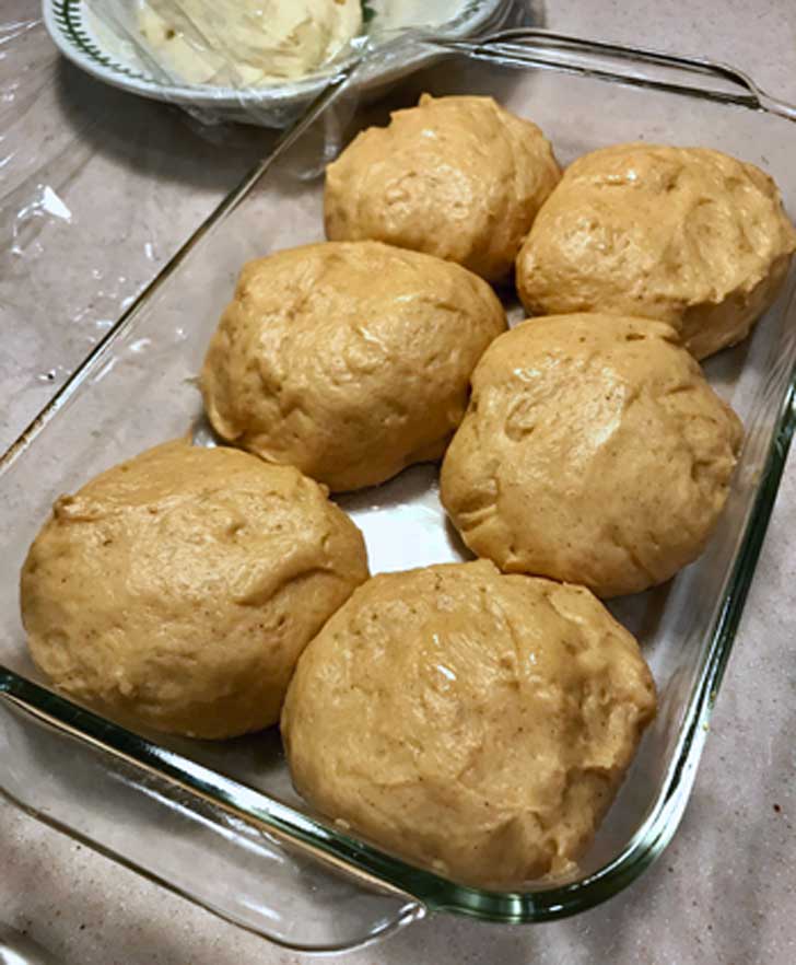 Pumpkin Spice Kolache dough in a glass dish.