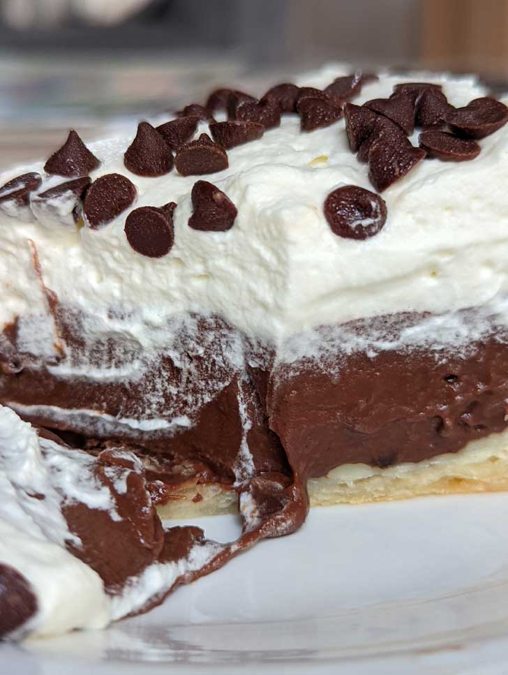 Evaporated Milk Chocolate Cream Pie slice showing soft egg-free texture.