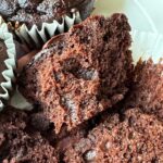 Chocolate oat fiber muffin with 79 calories split open to show texture.