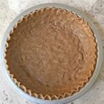 Unbaked pie shell with graham cracker flavored dough
