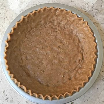 Unbaked pie shell with graham cracker flavored dough