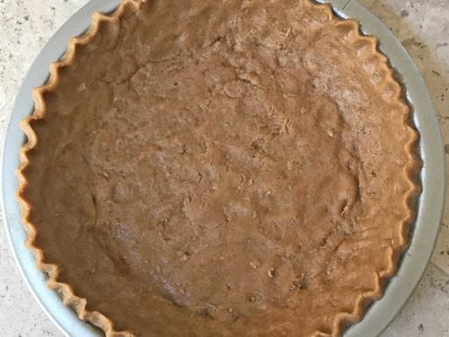 Unbaked pie shell with graham cracker flavored dough
