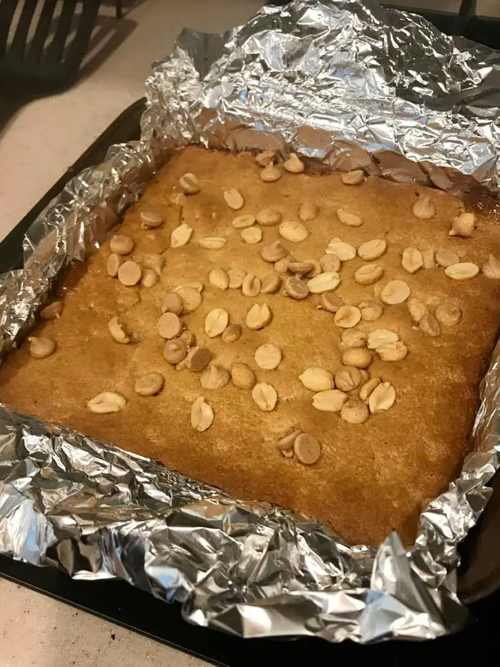 Cake Mix Peanut Butter Bars baked in an 8 inch square metal pan.