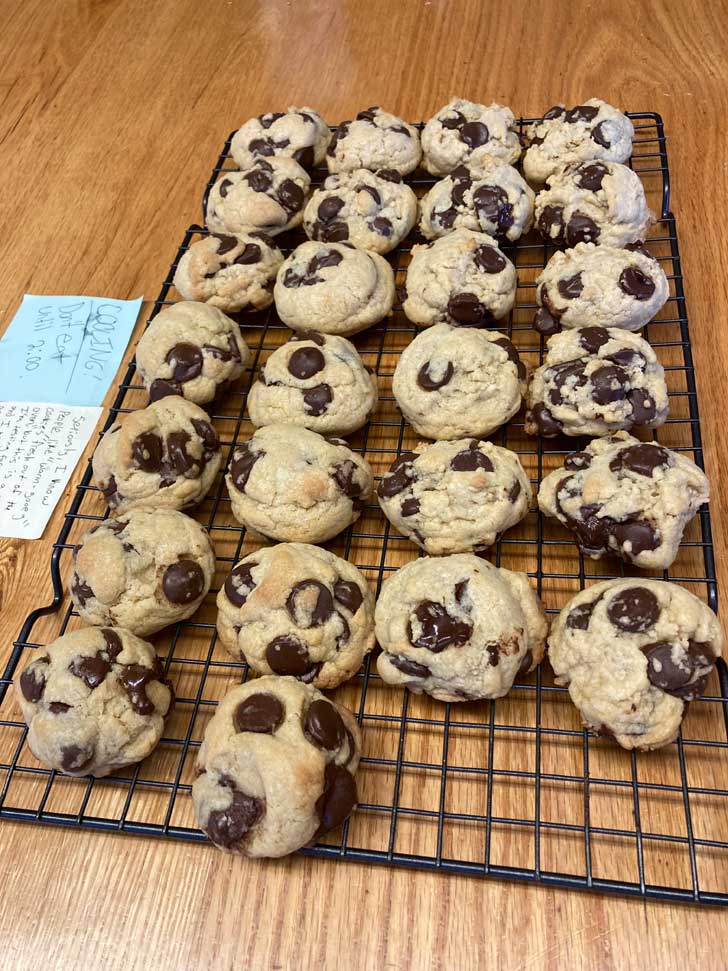 Soft, thick chocolate chip cookies on a cooling rack.