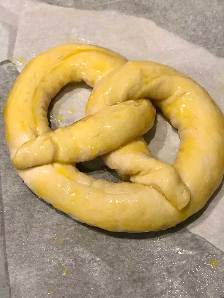 Pretzel dough with egg yolk to make it shiny