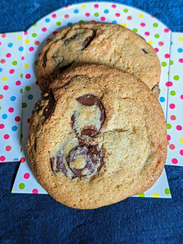 Two chocolate chip cookies amde with Cup4Cup flour.