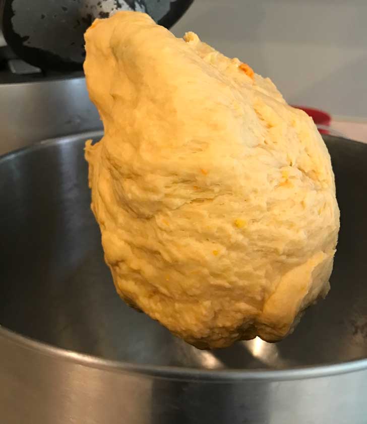 Sweet potato bread dough clinging to the dough hook.