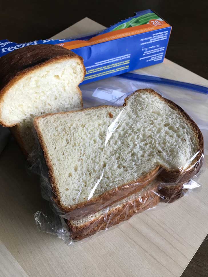 Bread wrapped in plastic and ready to freeze.