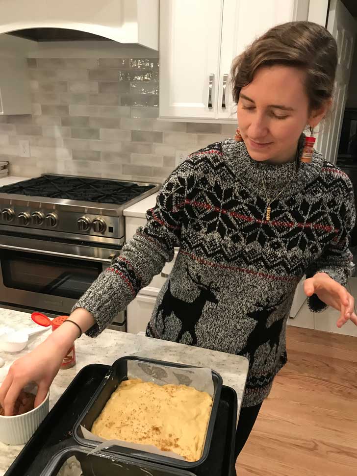 Fuzz about to make dimples in two pans of Moravian Sugar Cake dough.