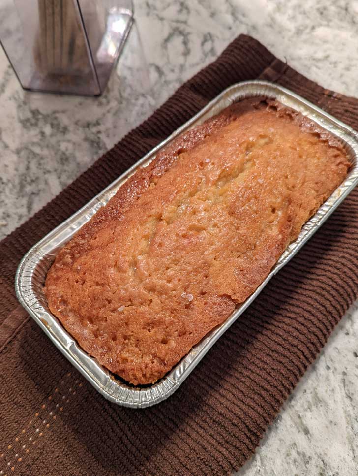 Coconut Rum Pound Cake baked in an 8x4 inch disposable foil pan from Dollar Tree.