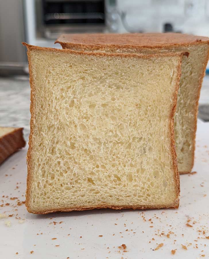 Cottage Cheese Bread recipe baked in a Pullman pan with the lid on.