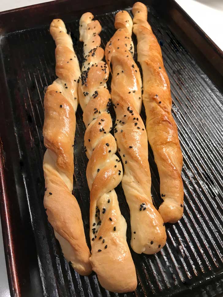 Quick Soft Breadsticks  with Nigella seeds on them.