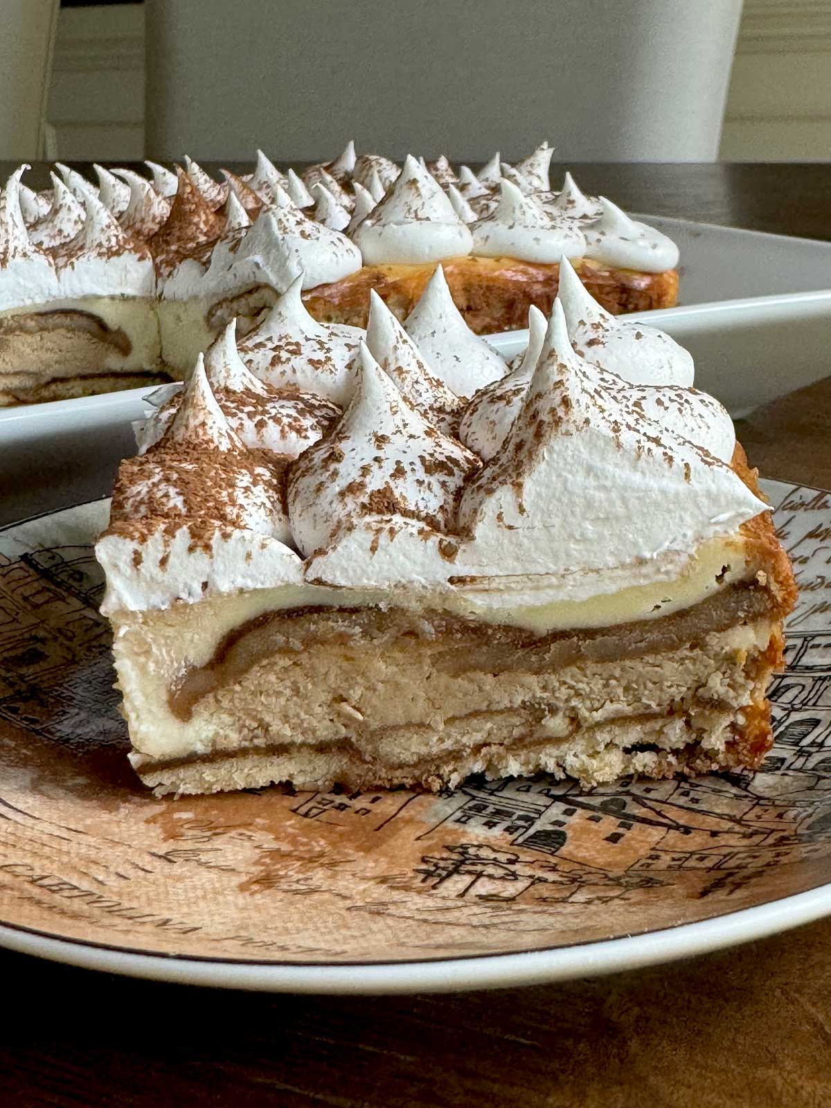 Slice of Tiramisu Cheesecake using a 9x13 inch pan cheesecake recipe.