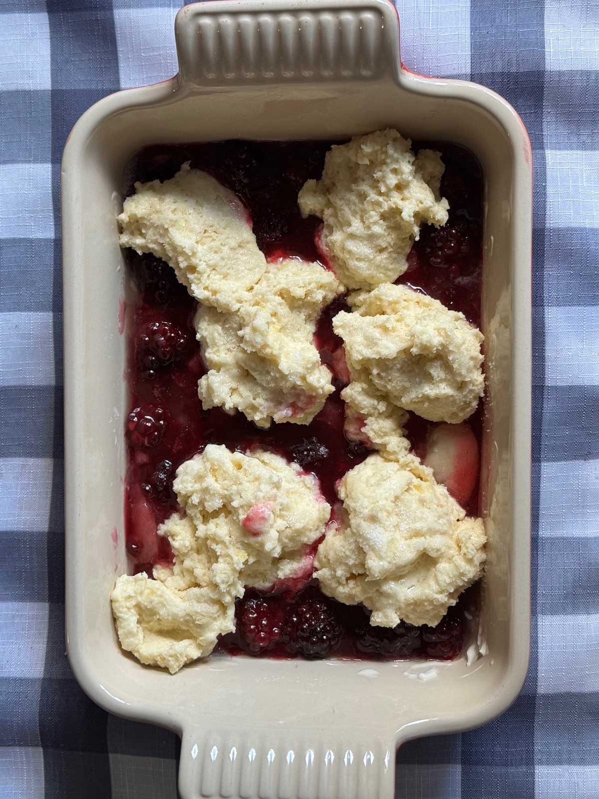 Quick Blackberry Cobbler recipe unbaked to show biscuit topping.