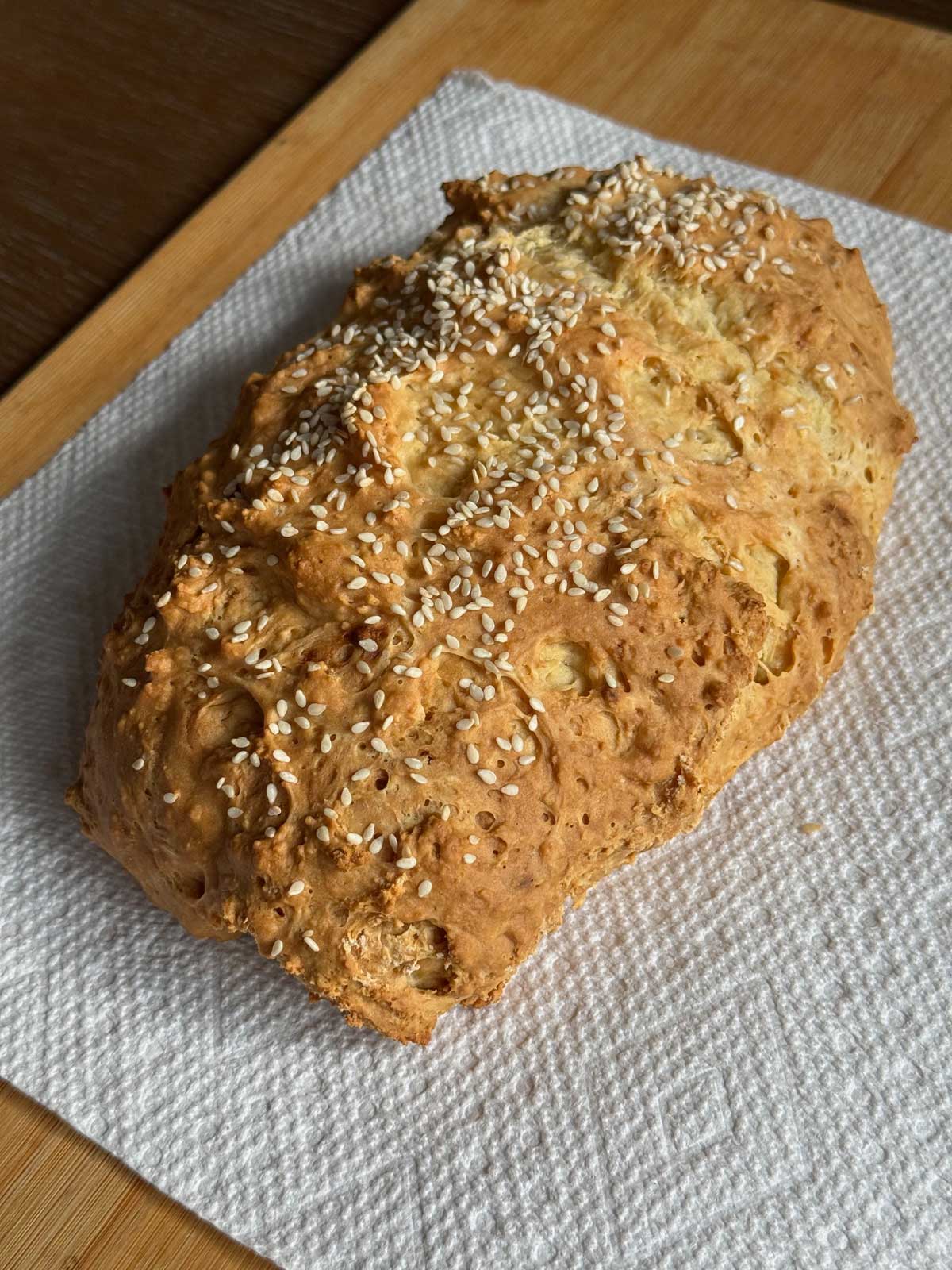 Small loaf of no-yeast sour cream and buttermilk bread with a golden crust.