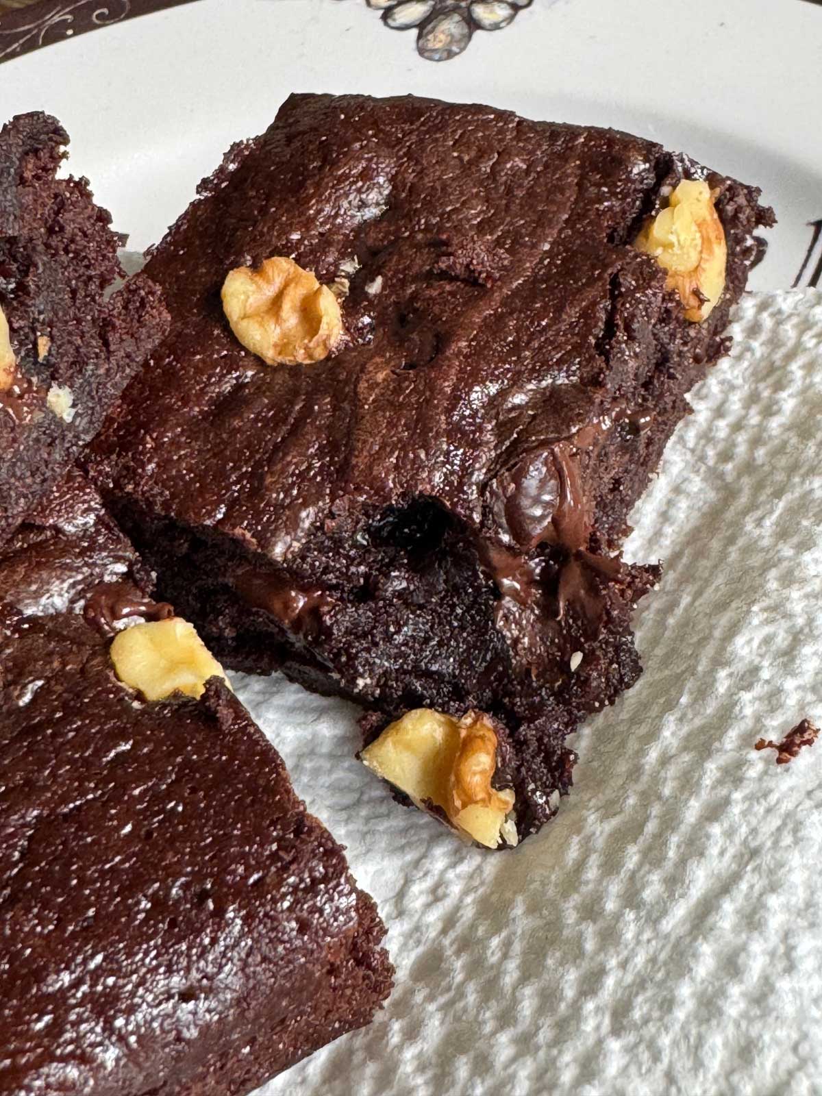 A fudgy brownie cut to show texture.