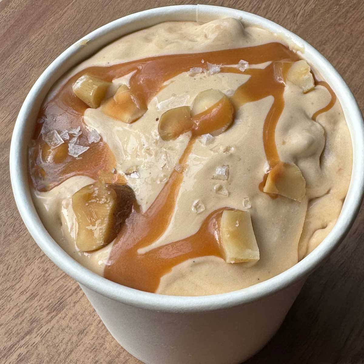 Salted Caramel Ice Cream with Skor Bars, nuts and caramel sauce swirled through.