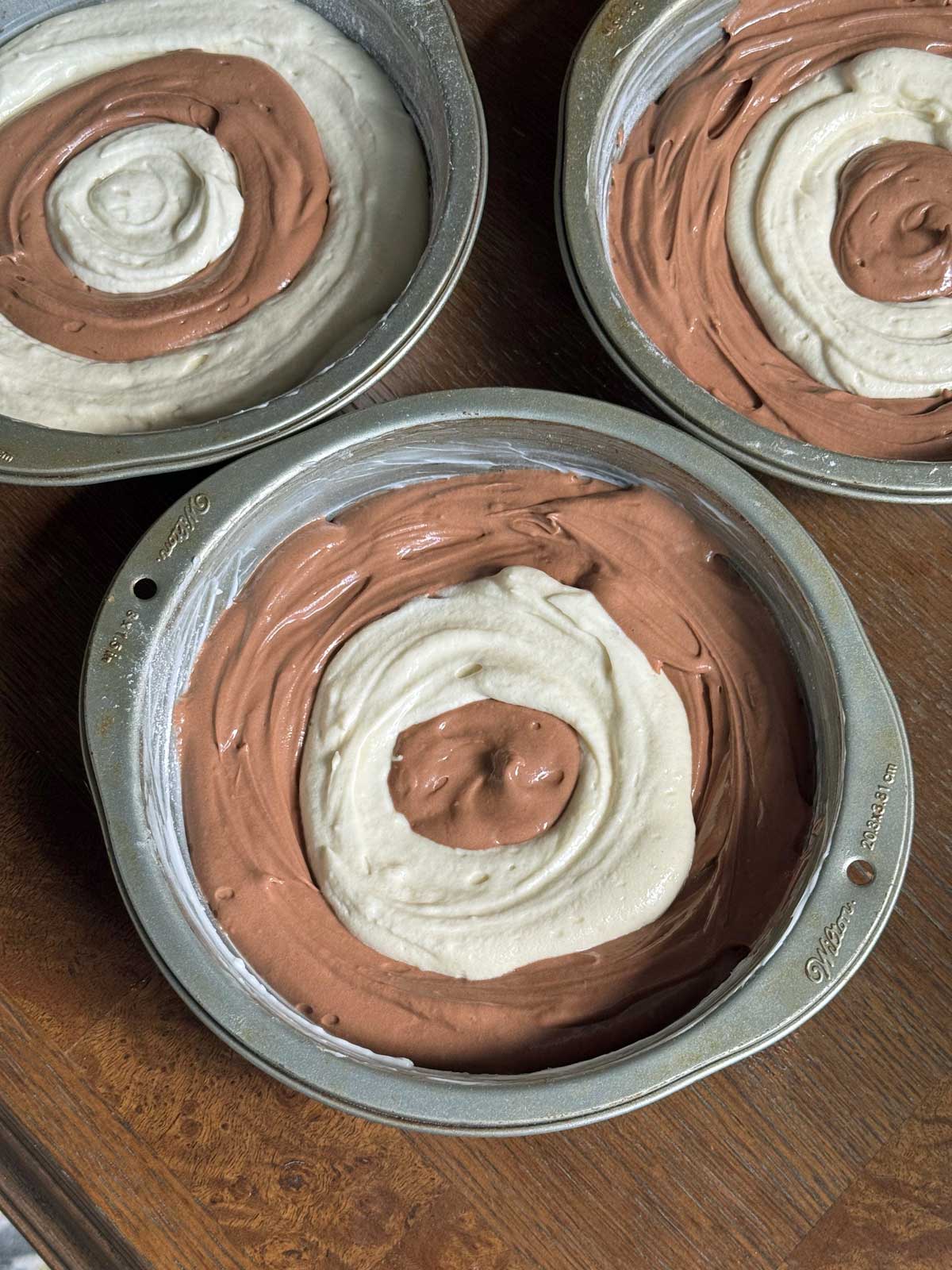 Pattern for adding vanilla and chocolate batter to pans for checkerboard cake.