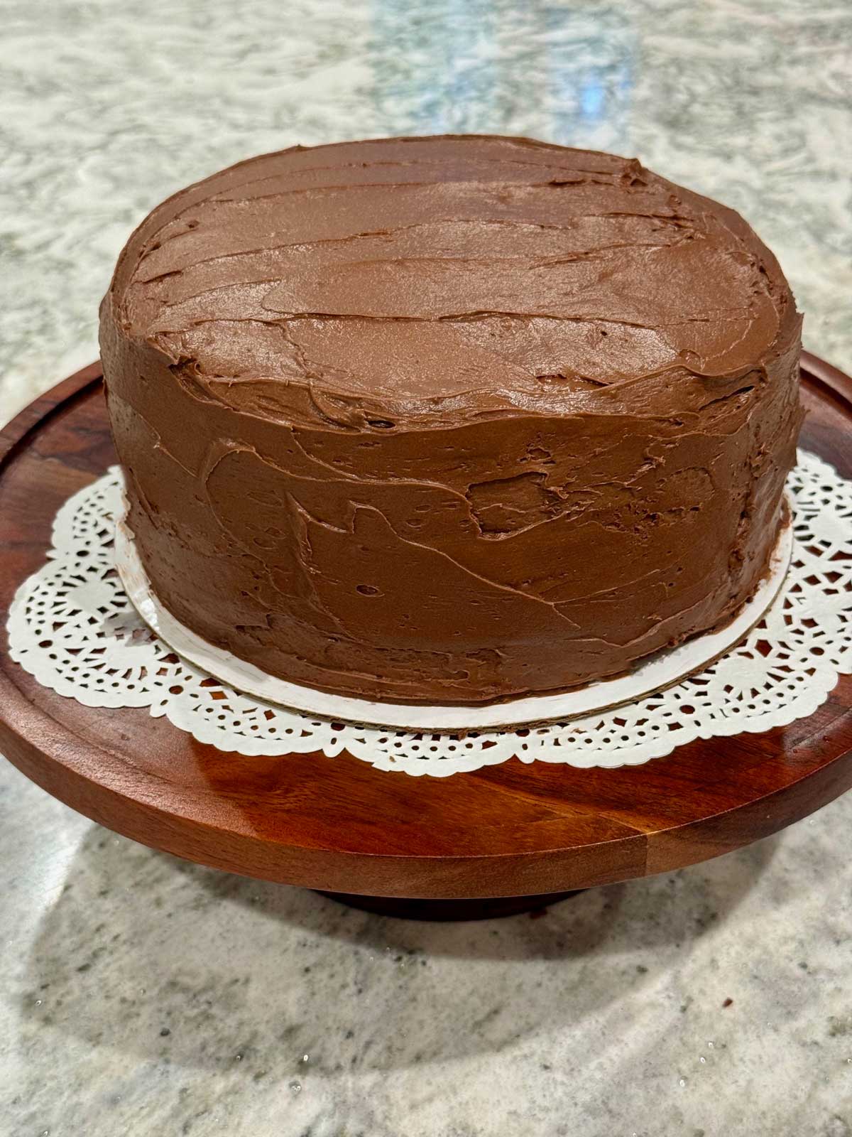 An 8-inch cake with chocolate frosting from the Ghirardelli cocoa bag.