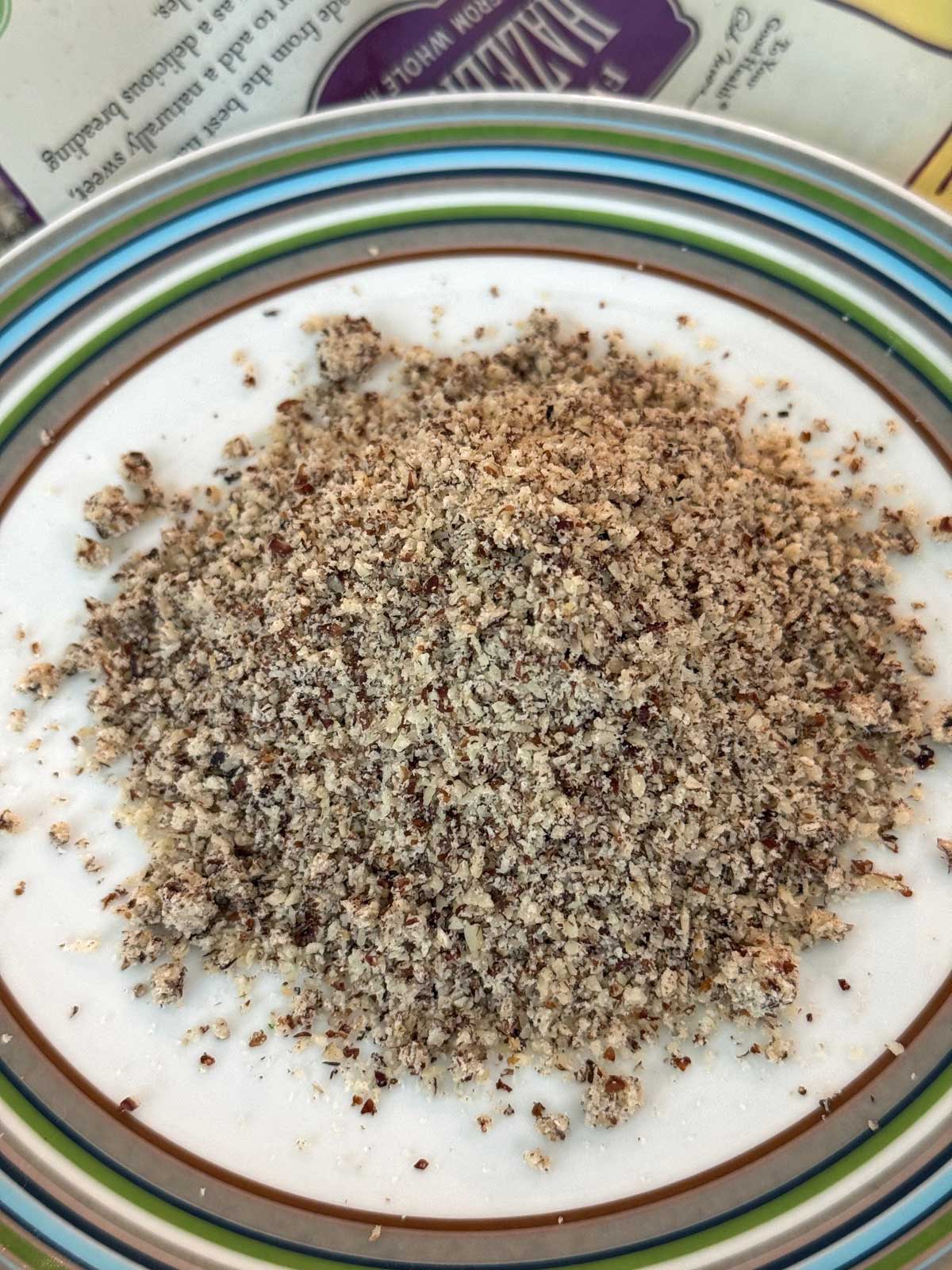 Bob's Red Mill brand hazelnut flour poured on a plate to show texture.
