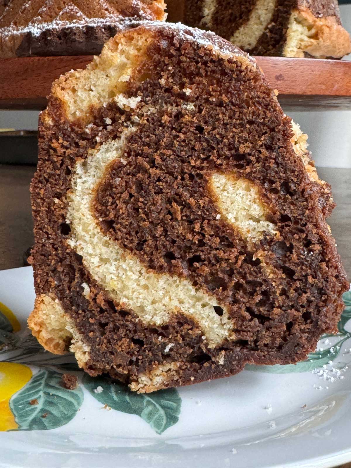 Slice of molasses and lemon cake on a plate.