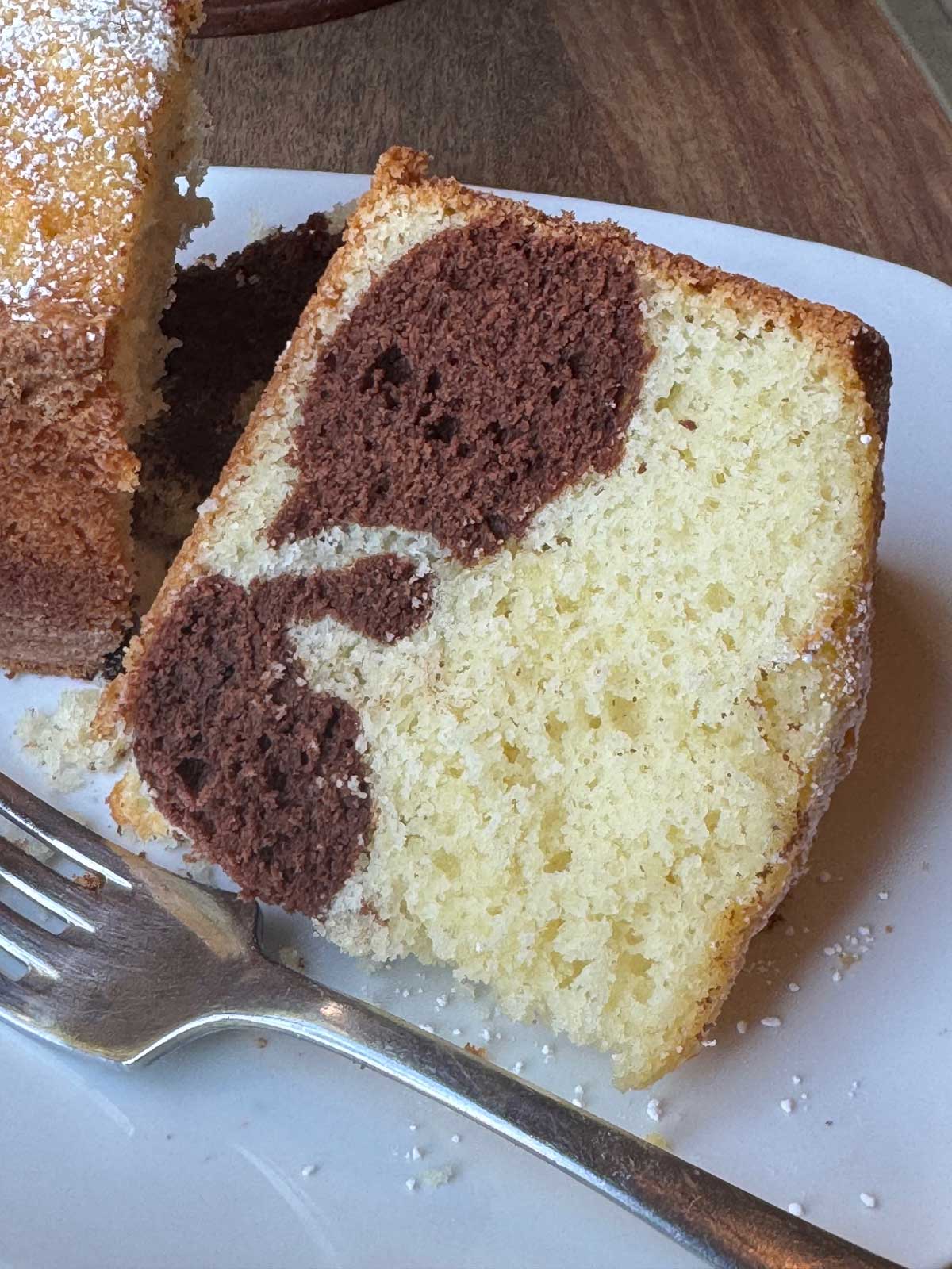 Slice of The Settlement Cookbook marble cake and recipe.
