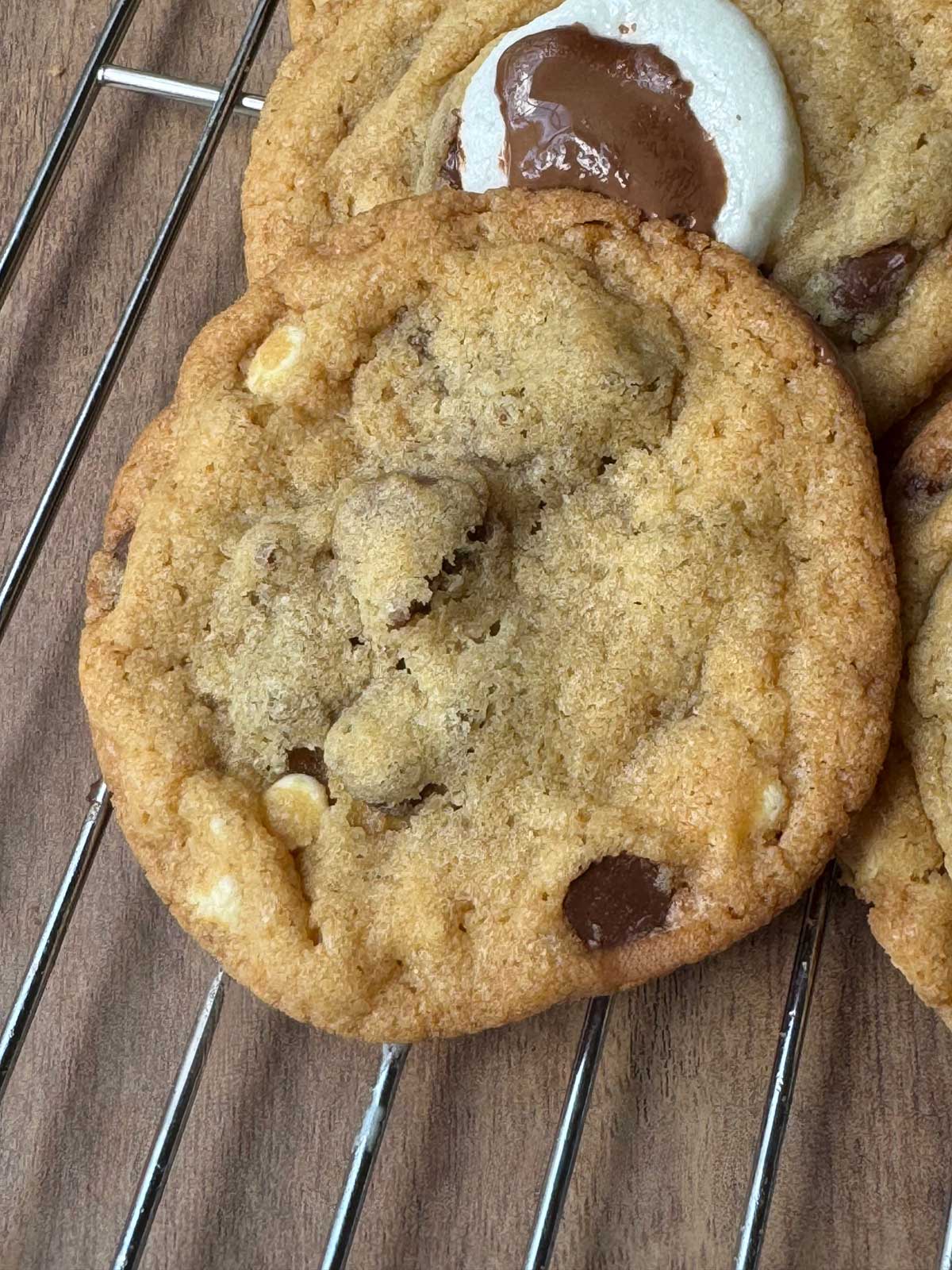 Coffee Malt Cookies recipe showing cookies cooling on a rack with marshmallow and chocolate on top.
