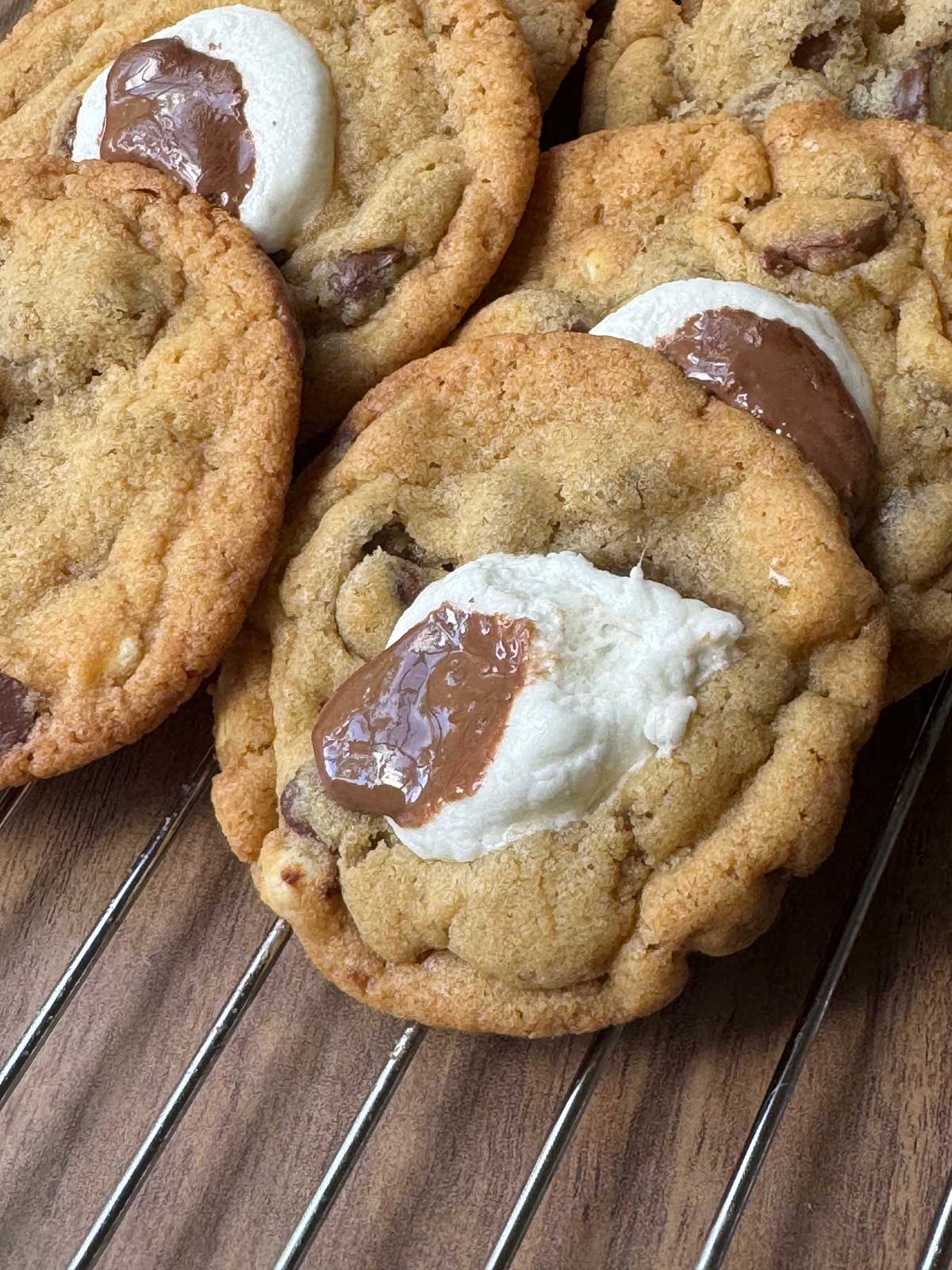 Coffee Malt Cookies recipe showing cookies cooling on a rack with marshmallow and chocolate on top.