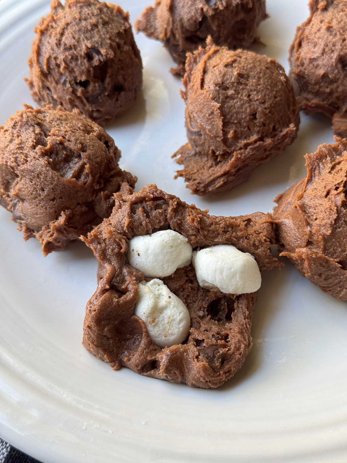 Espresso Marshmallow Cookies dough beings stuffed with marshmallow pieces.