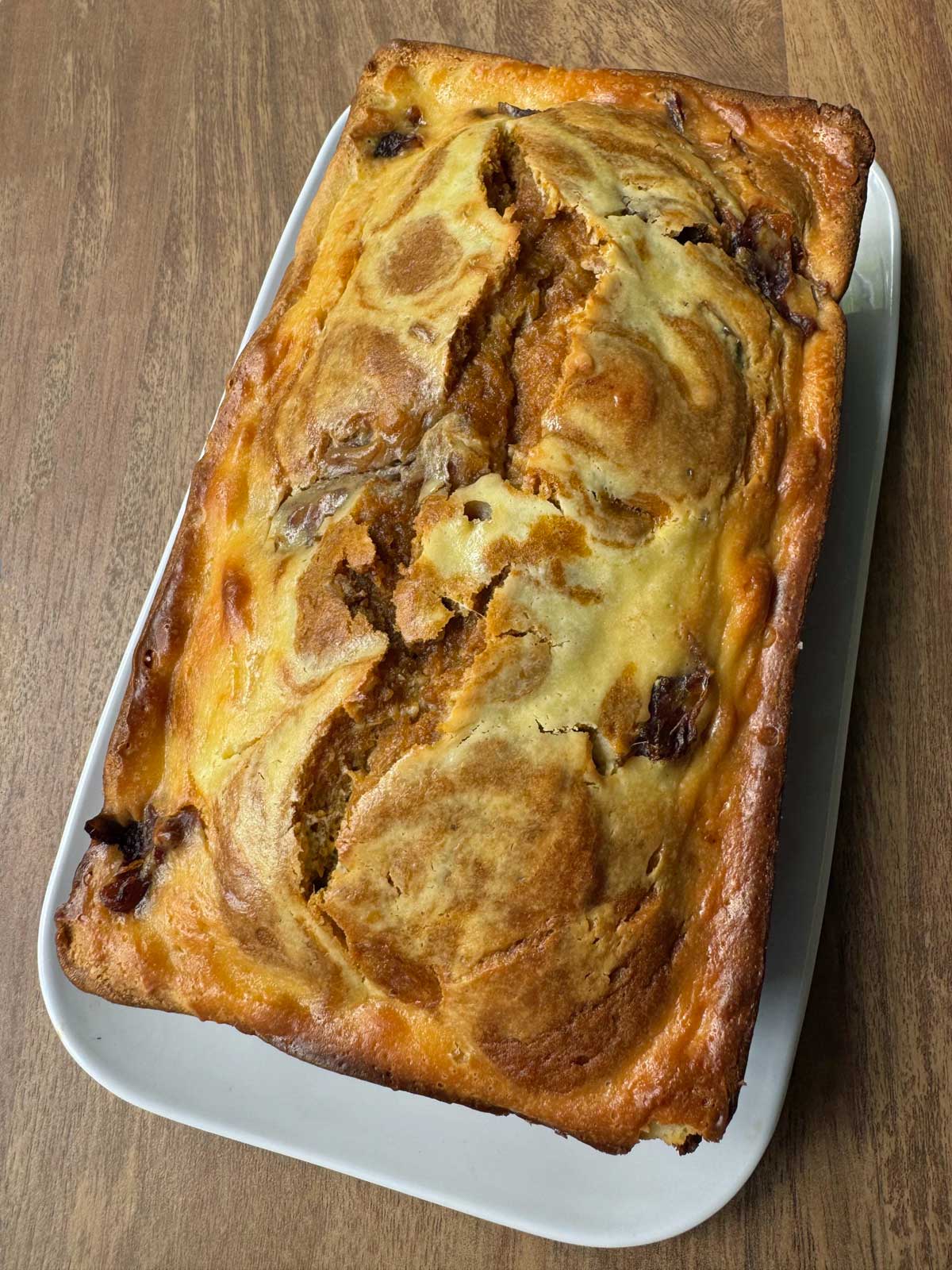 Pumpkin Date Cream Cheese Swirl Bread recipe baked in a 9x5 inch loaf pan.