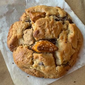 A giant Peanut Butter Chocolate Chunk Pretzel cookie made with an easy recipe that makes cookies perfect for giving as gifts.