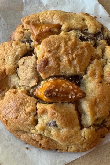 A giant Peanut Butter Chocolate Chunk Pretzel cookie made with an easy recipe that makes cookies perfect for giving as gifts.
