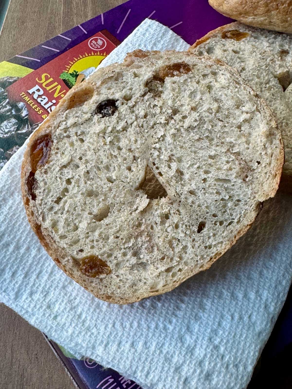 Bagel made with Raisin Bran cereal split to show how many raisins.