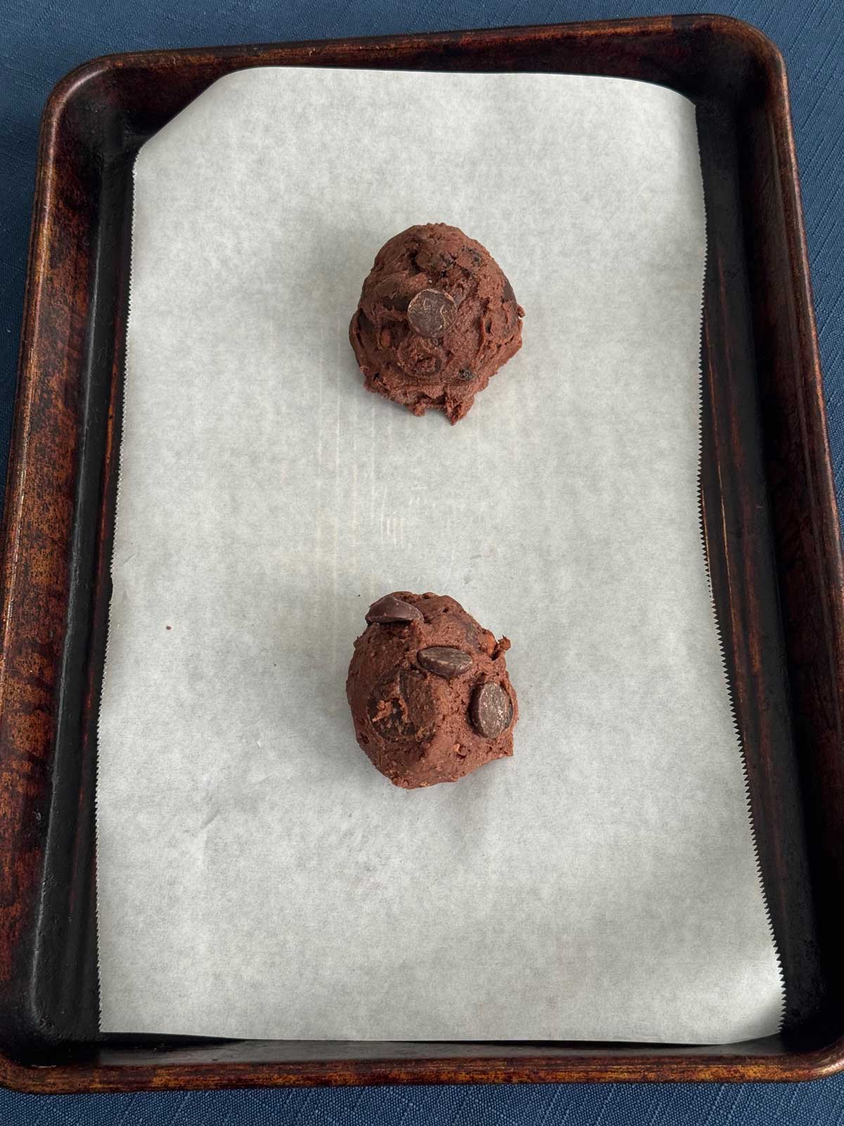 Sourdough Discard Chocolate Cherry Cookies on a parchment lined baking sheet.