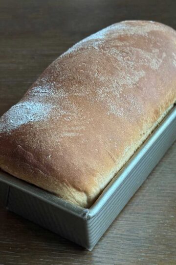 Sourdough Cheddar Swirl bread recipe baked in a loaf pan.