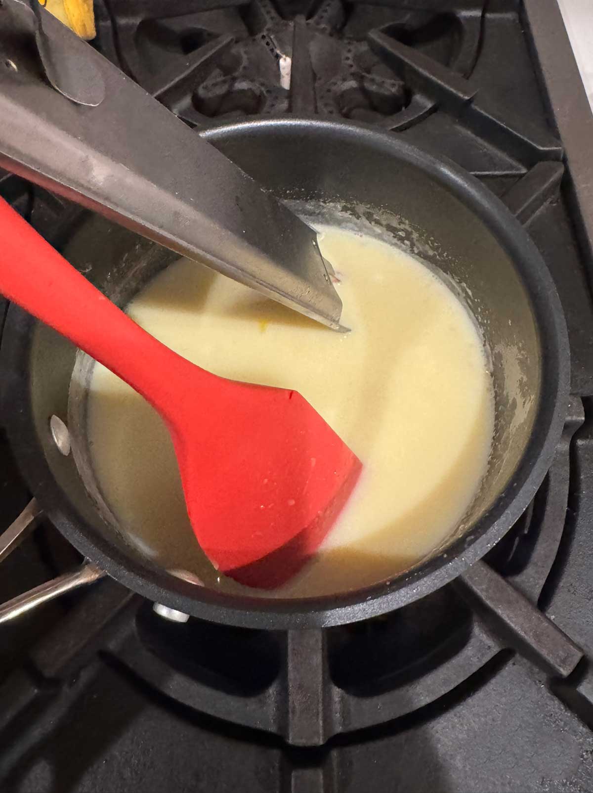 Making a custard with milk, allulose, xanthan gum, salt and eggs.