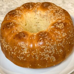 Buttery Batter Bread baked in a silicone fluted pan coated with sesame seeds.