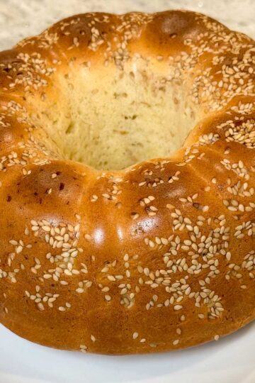 Buttery Batter Bread baked in a silicone fluted pan coated with sesame seeds.