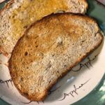 Dakota Bread sliced and toasted with butter.