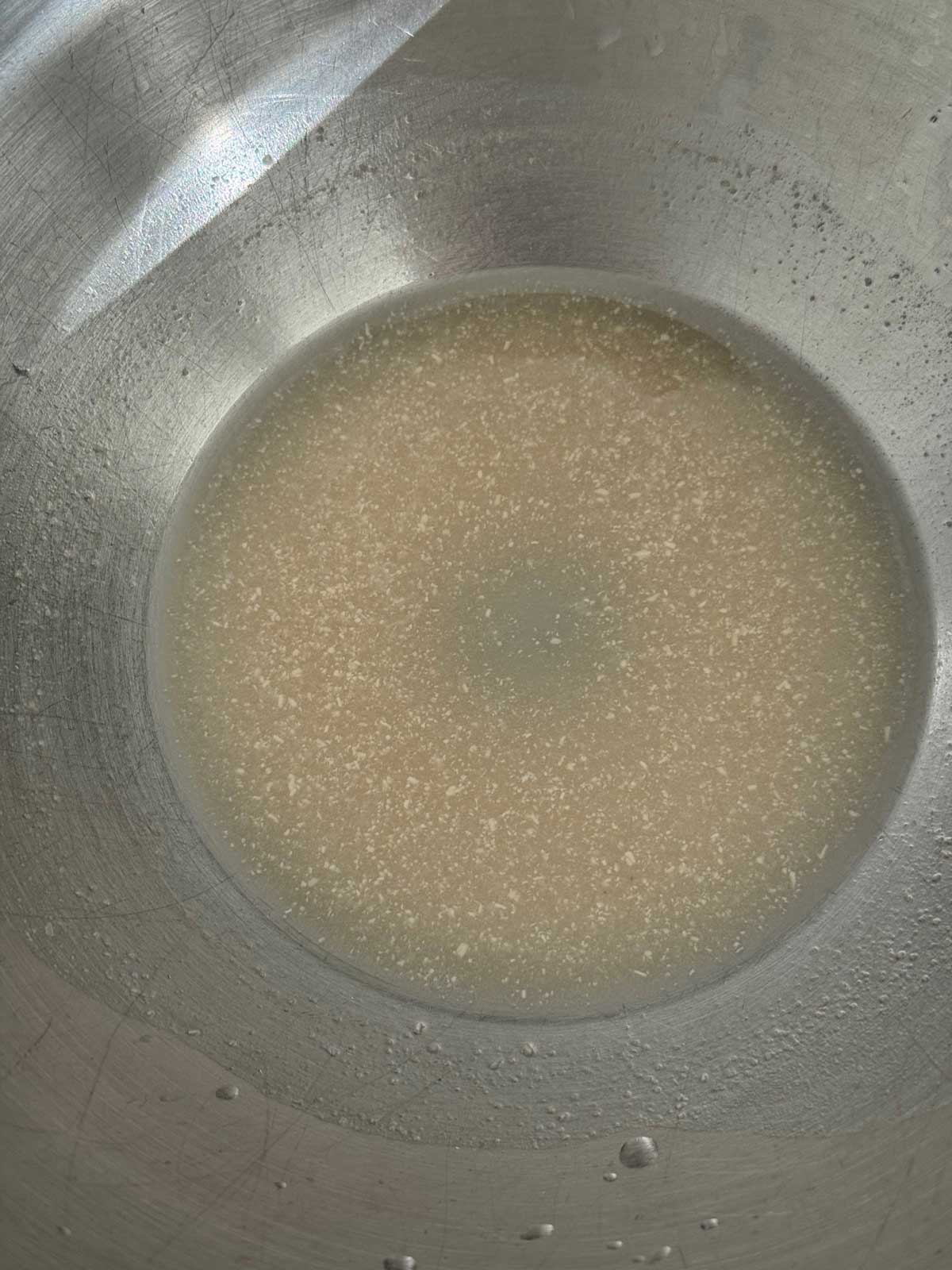 Proof the yeast in ¼ cup of warm water with a teaspoon of sugar.